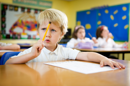 A young boy taking a quiz