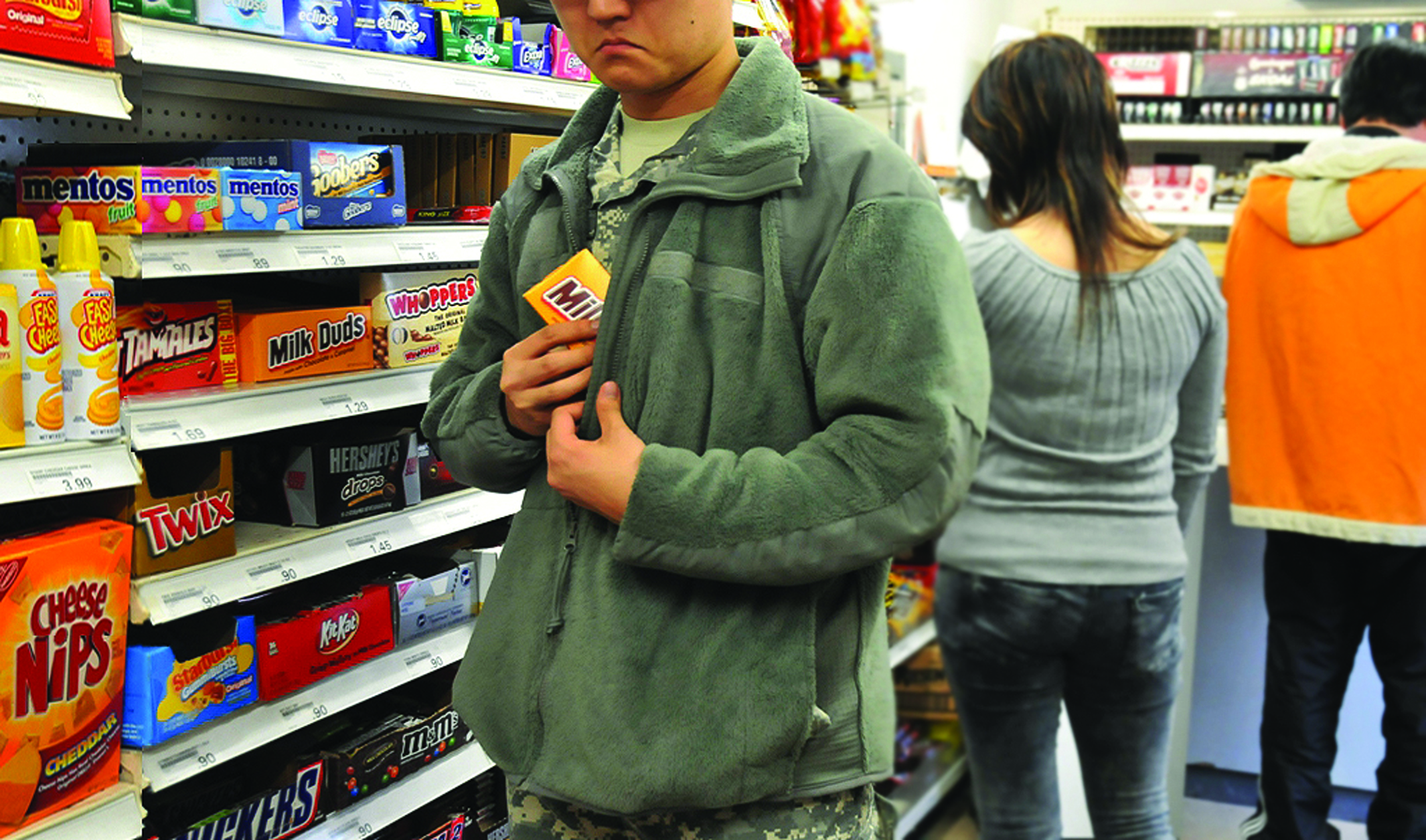 Image of man stealing Milk dudes at convenient store