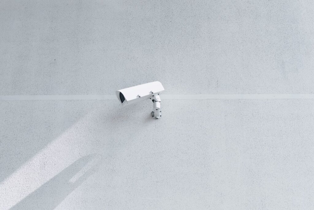 White camera placed on wall